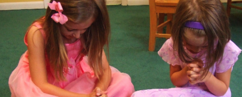 Two Girls Praying